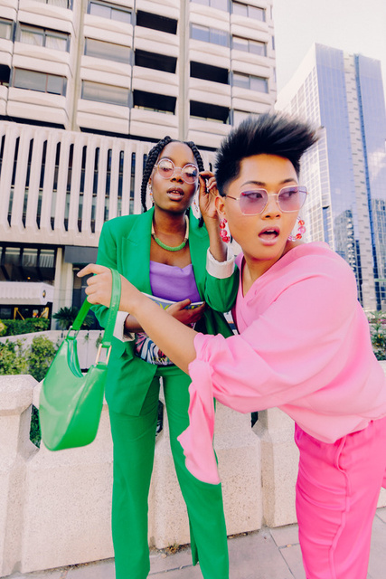 Two friends in bold second-hand street style outfits