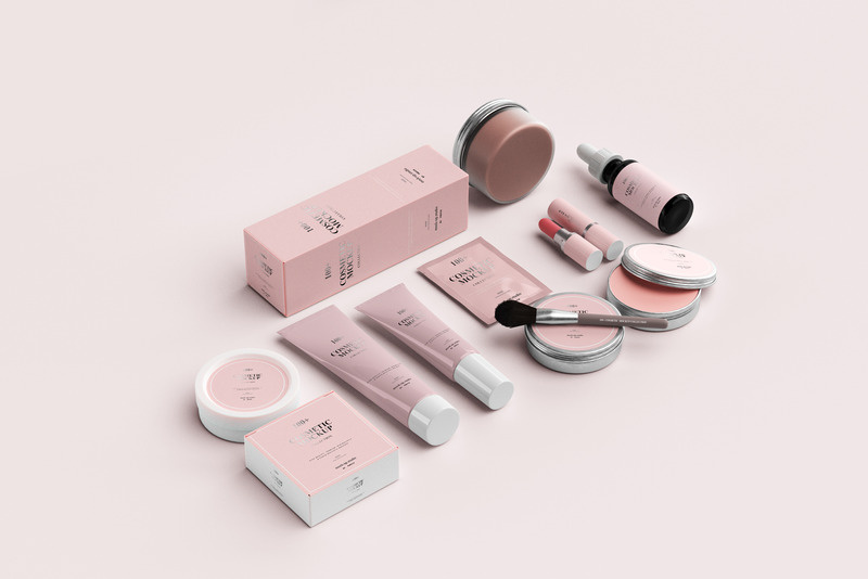 Pink beauty product range laid out on a soft background